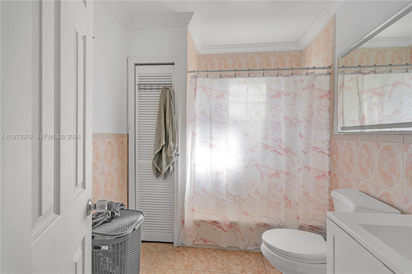 2900 Southwest 19th Street Miami, FL 33145 - Photo 12 of 24 a bathroom with a granite countertop shower a toilet and a shower