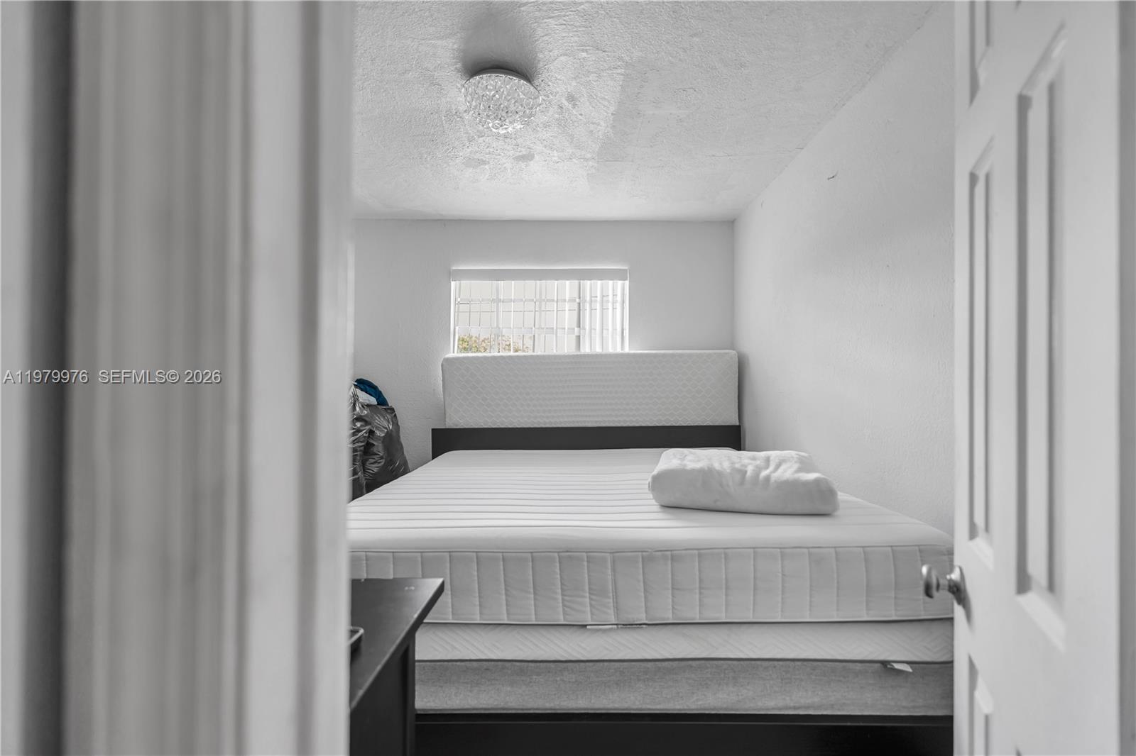 2900 Southwest 19th Street Miami, FL 33145 - Photo 14 of 24 a bedroom with a bed and a window