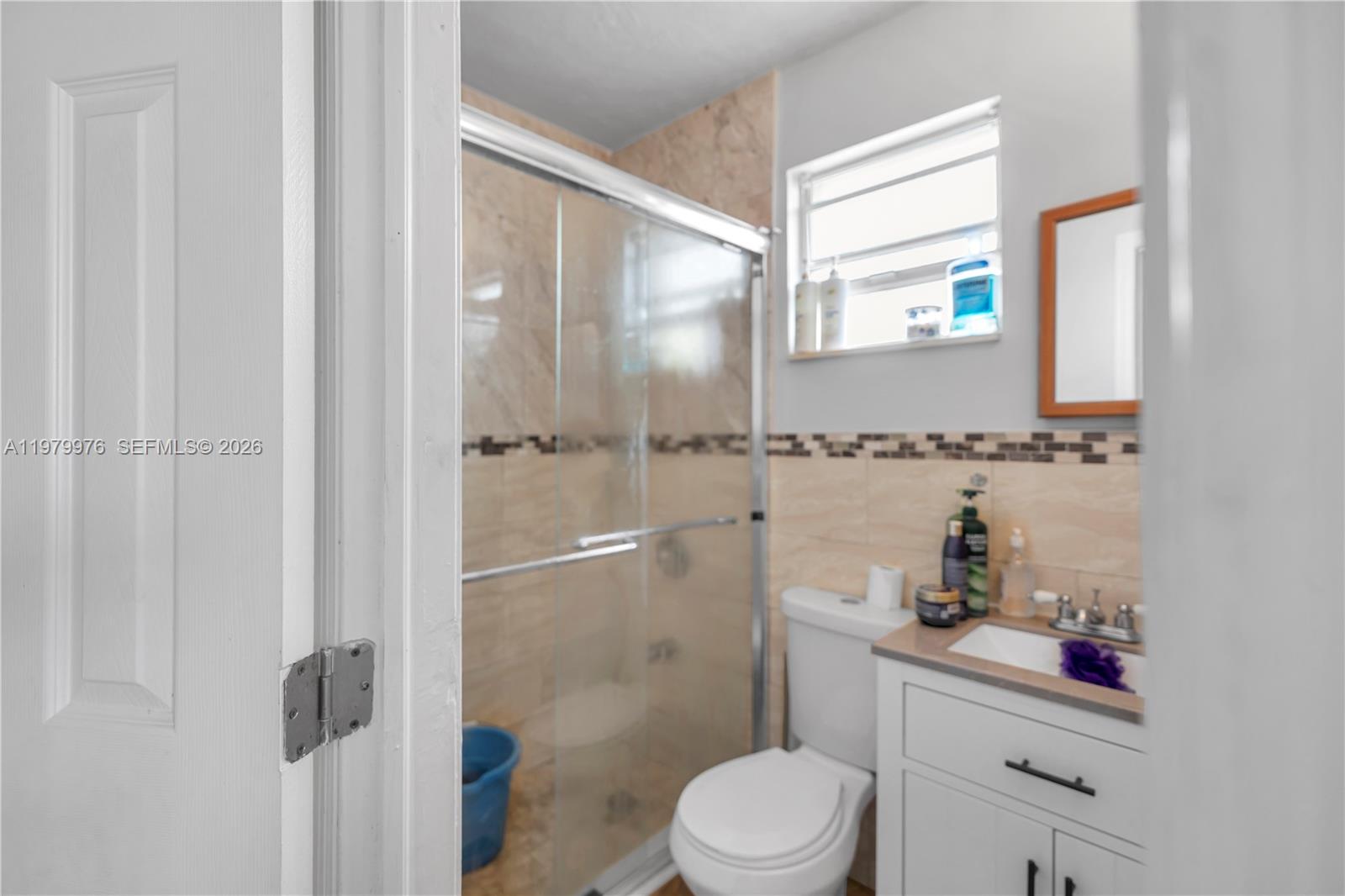 2900 Southwest 19th Street Miami, FL 33145 - Photo 15 of 24 a bathroom with a sink a toilet and shower