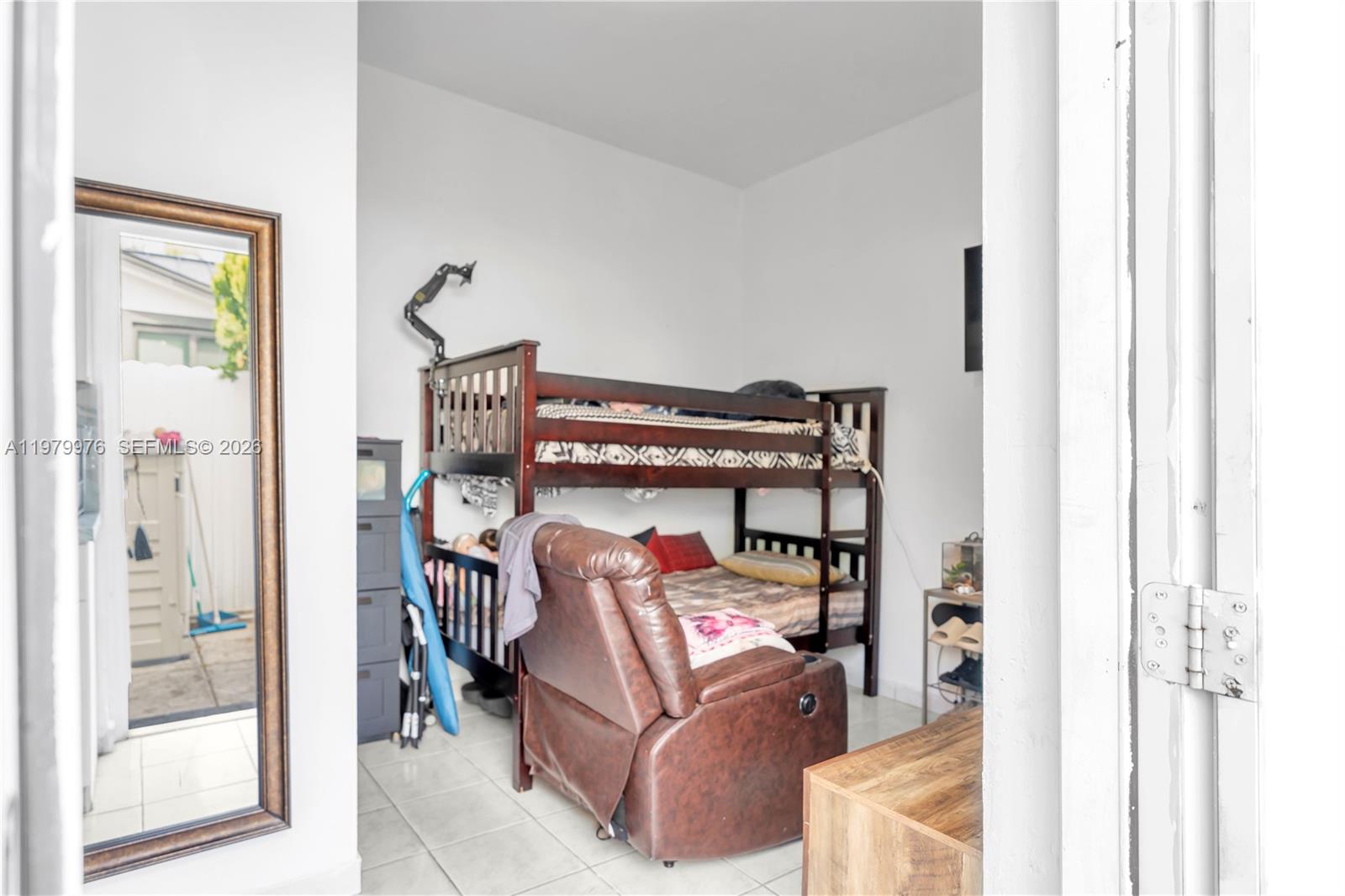 2900 Southwest 19th Street Miami, FL 33145 - Photo 16 of 24 a living room with furniture and a mirror