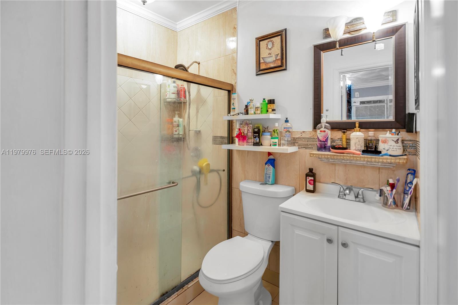2900 Southwest 19th Street Miami, FL 33145 - Photo 21 of 24 a bathroom with a sink mirror vanity and toilet