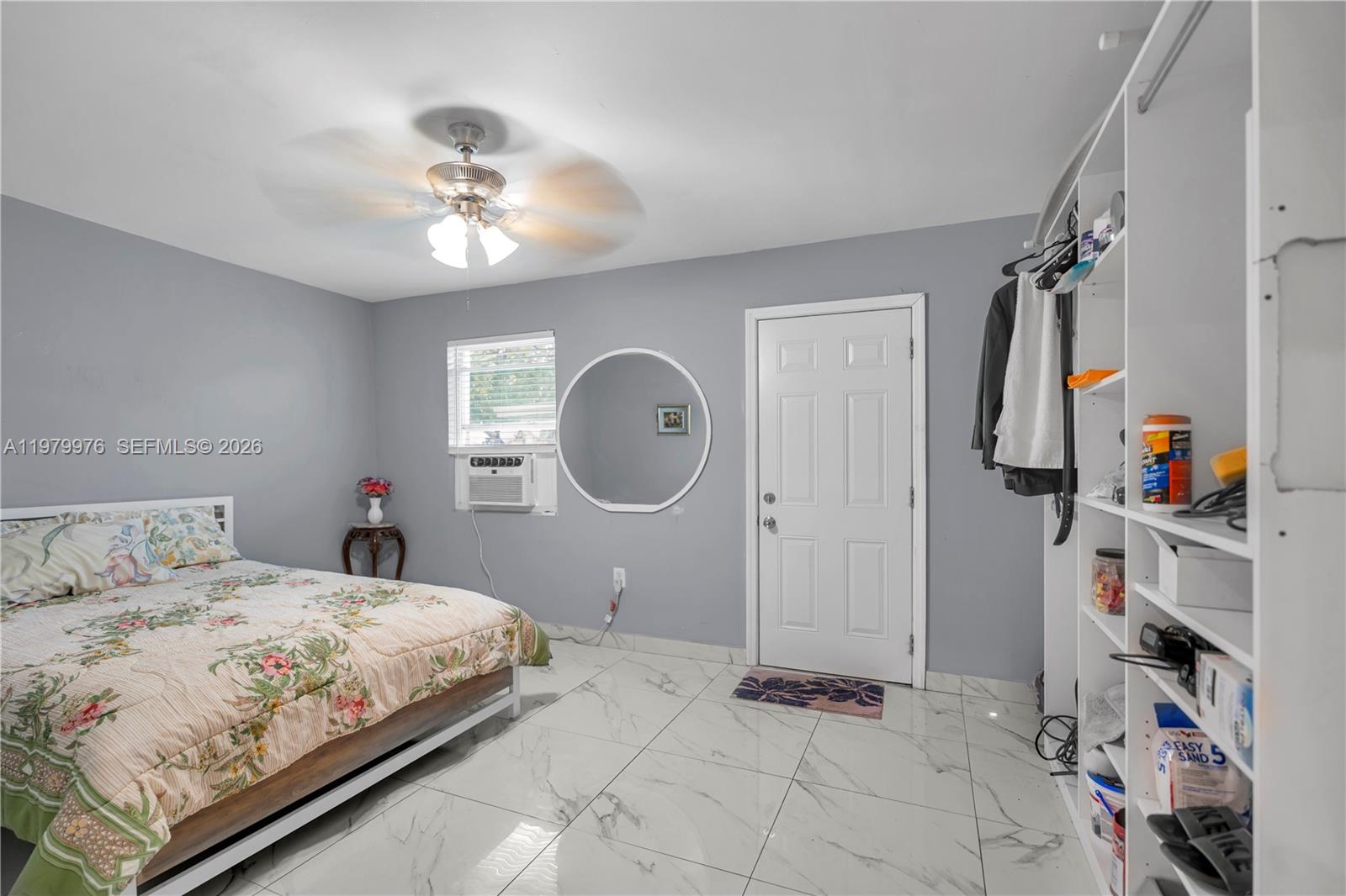 2900 Southwest 19th Street Miami, FL 33145 - Photo 9 of 24 a bedroom with a large bed and a chandelier