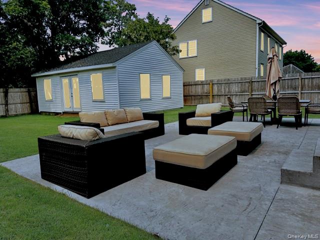 275 Sound Road Greenport, NY 11944 - Photo 12 of 33 Fenced backyard with a patio area, an outdoor living space, and french doors