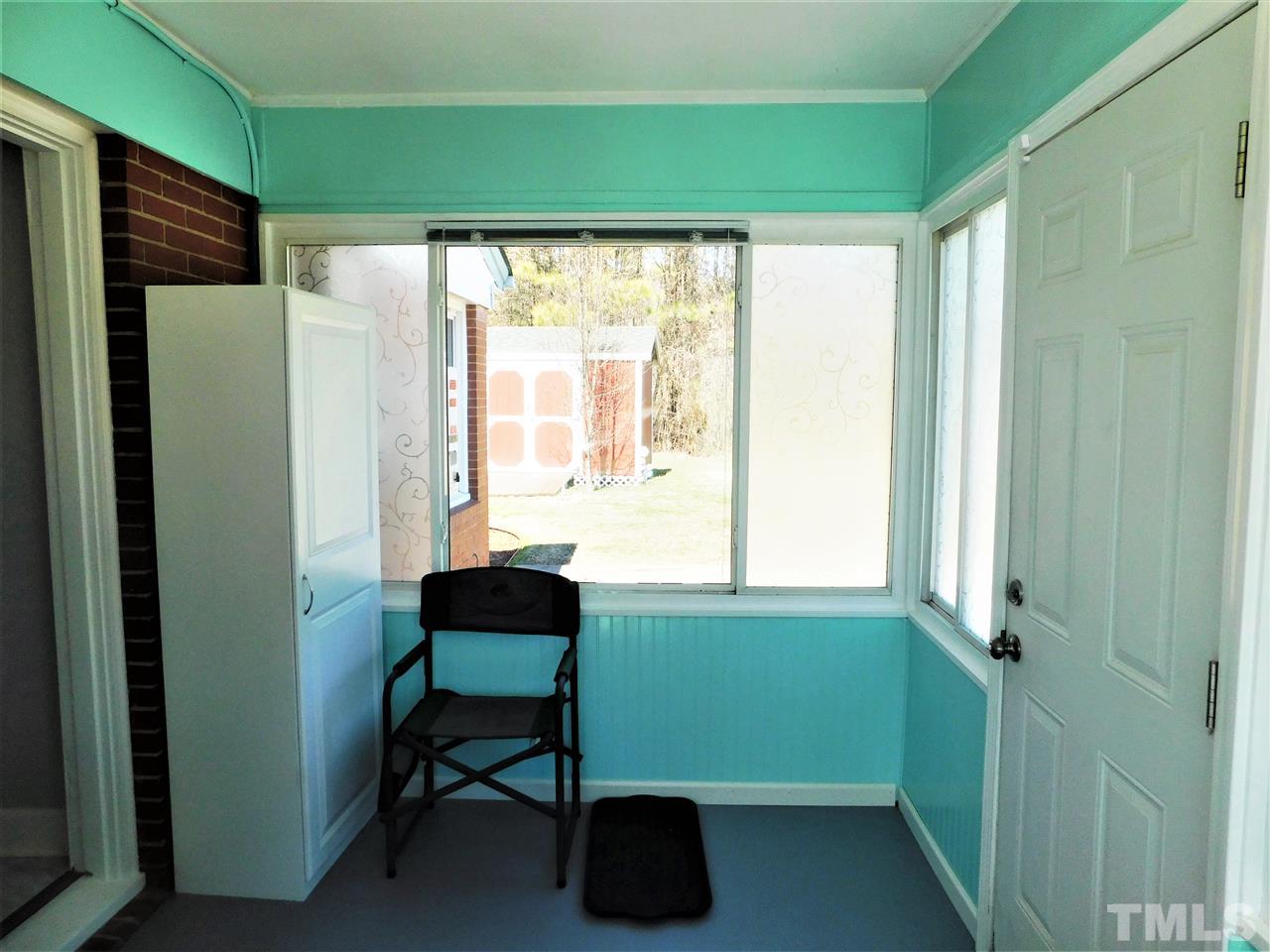3033 Ross Road Durham, NC 27703 - Photo 2 of 30 a room with window and a chair