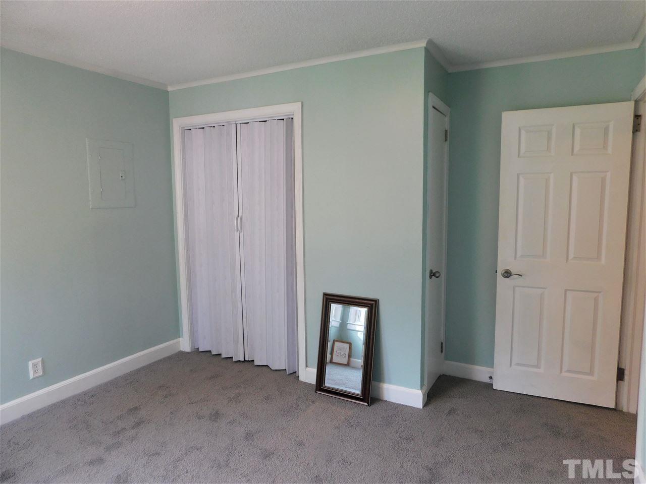 3033 Ross Road Durham, NC 27703 - Photo 12 of 30 a view of an empty room with closet area
