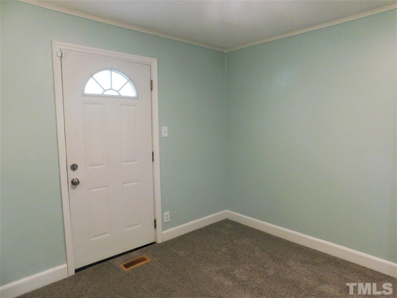 3033 Ross Road Durham, NC 27703 - Photo 14 of 30 an empty room with a window