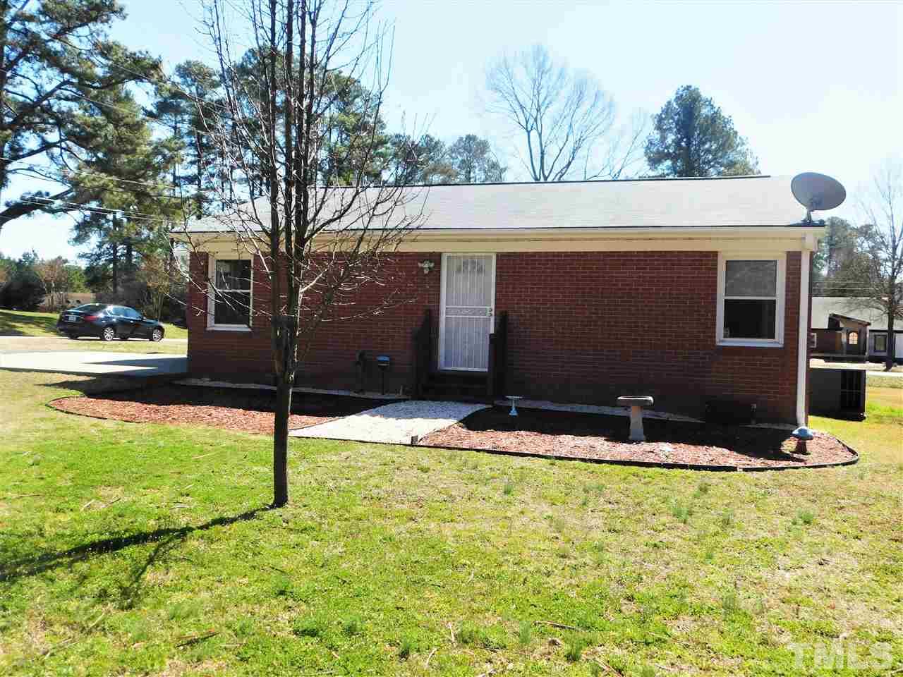 3033 Ross Road Durham, NC 27703 - Photo 23 of 30 a front view of house with yard