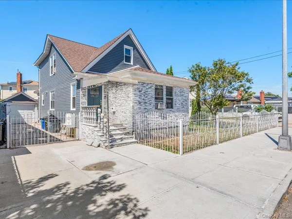 a front view of a house with a outdoor view