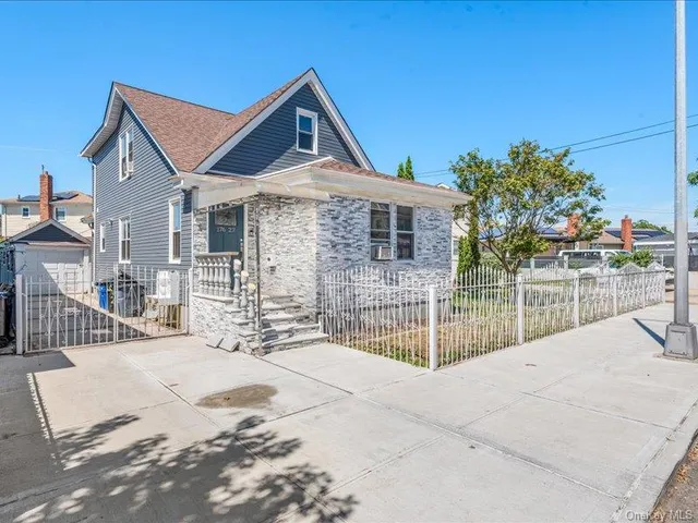 a front view of a house with a outdoor view