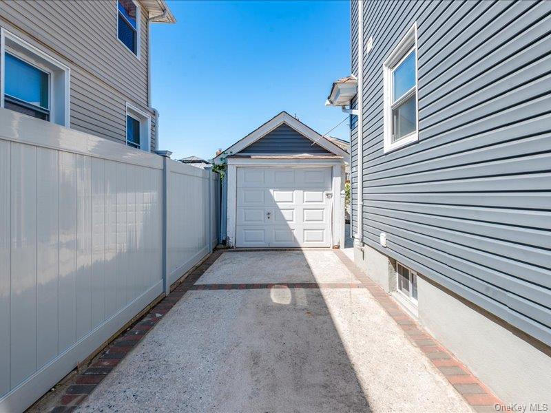 176-27 Sunbury Road Queens, NY 11434 - Photo 2 of 31 Detached garage with concrete driveway