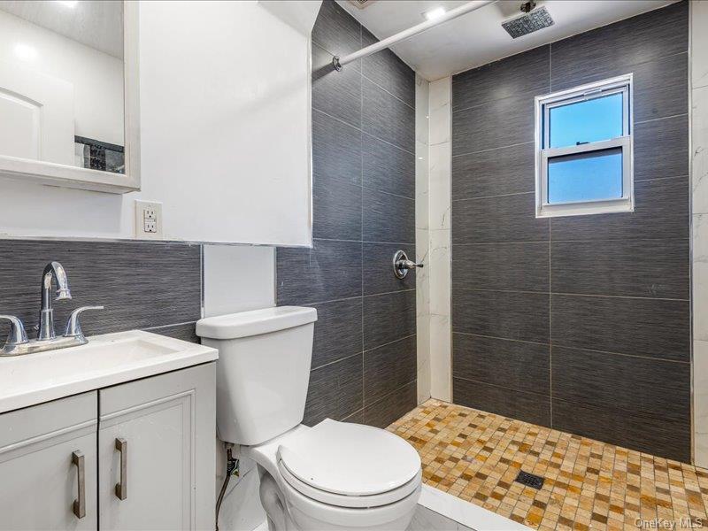 176-27 Sunbury Road Queens, NY 11434 - Photo 23 of 31 Bathroom featuring vanity and a stall shower