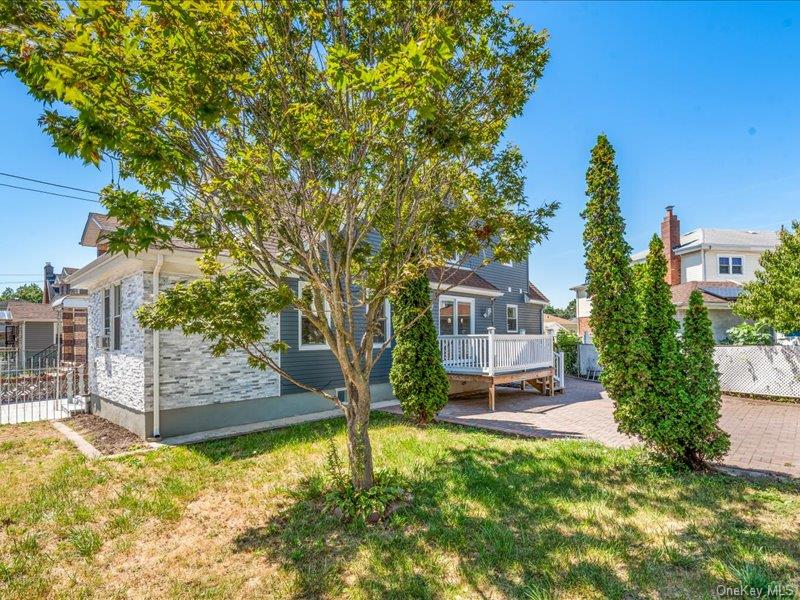 176-27 Sunbury Road Queens, NY 11434 - Photo 6 of 31 Rear view of property featuring a wooden deck
