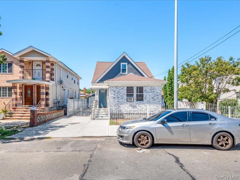 176-27 Sunbury Road Queens, NY 11434 - Photo 9 of 31 View of front of property featuring a gate and roof with shingles