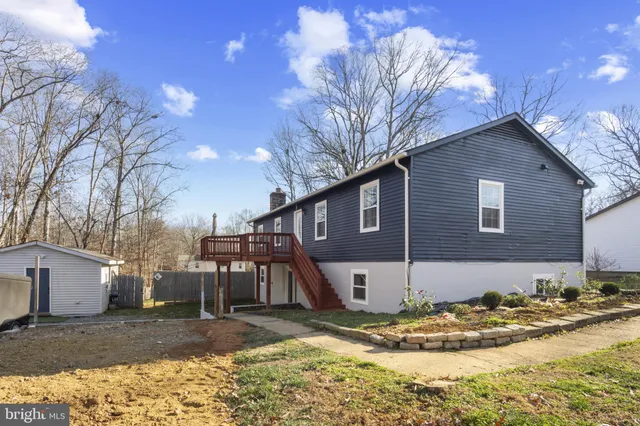 a view of a house with a snow in the yard