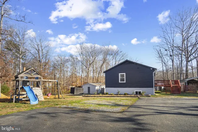 a view of a house with a yard and garage
