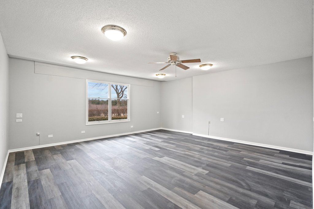 4632 West Offner Road Monee, IL 60449 - Photo 24 of 116 a view of an empty room with wooden floor and a window