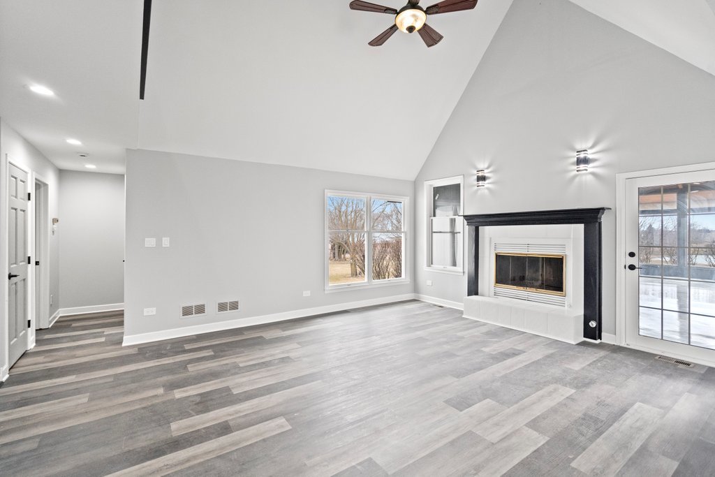 4632 West Offner Road Monee, IL 60449 - Photo 36 of 116 a view of an empty room with a fireplace and a window