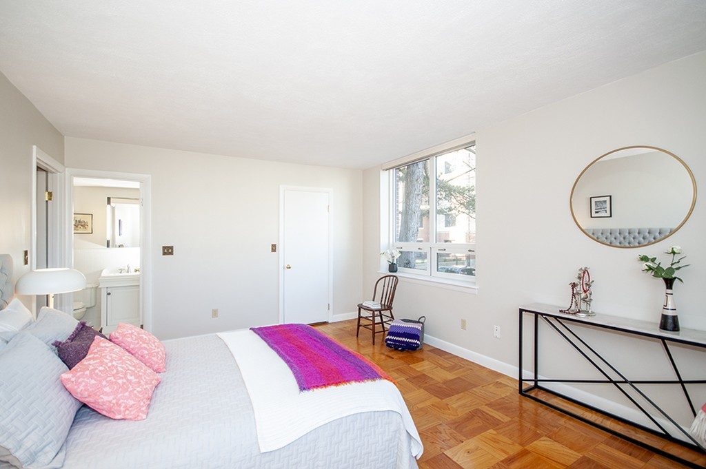 41 Park Street, Unit 207 Brookline, MA 02446 - Photo 20 of 25 a bedroom with a bed and window