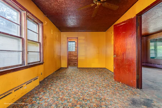 a view of a hallway with a door