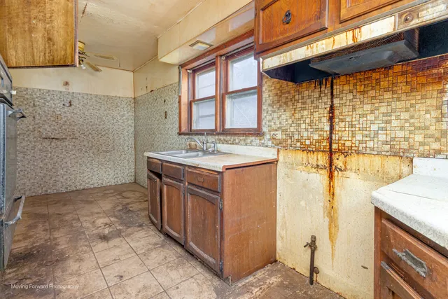 a bathroom with a sink a vanity and a shower