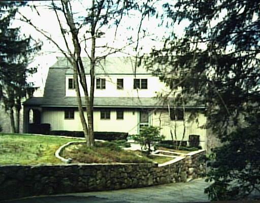 94 Old Mill Road Wilton, CT 06897 - Photo 1 of 1 a front view of a house with garden