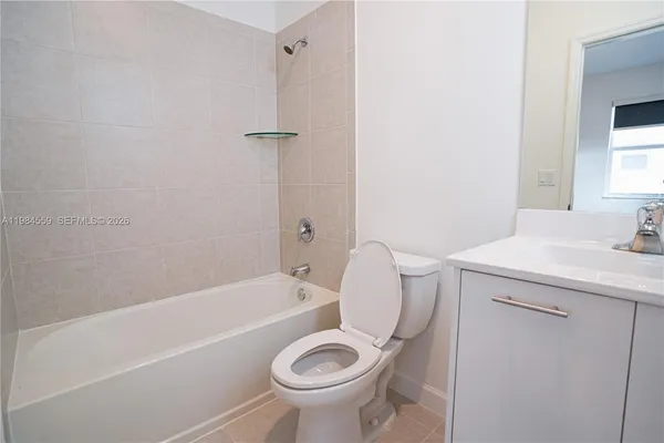 a bathroom with a sink a toilet and a bathtub