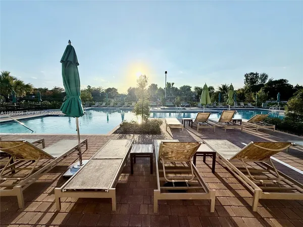 a view of a lake with outdoor seating