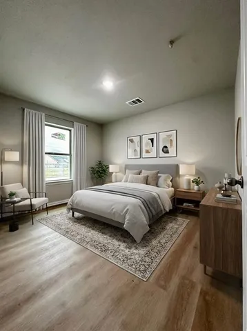 a bedroom with a large bed and a window