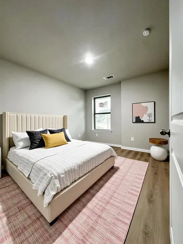 a bedroom with a bed and a couch