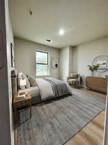 a bedroom with bed and window