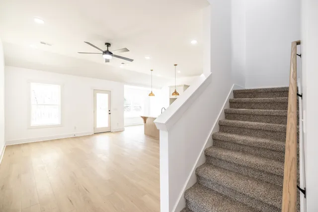 a view of an entryway with wooden floor