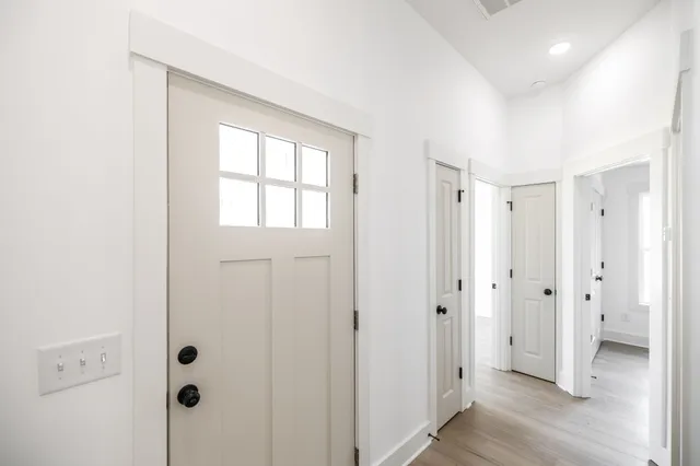 a view of a bathroom with closet area