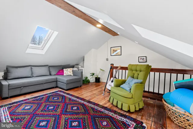 a living room with furniture and a rug