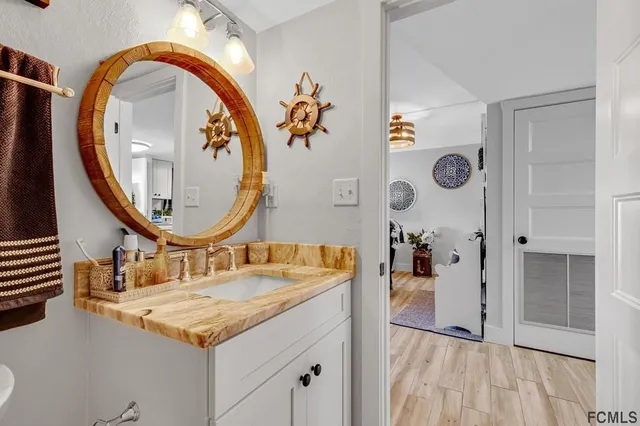 a view of a house with porch and garden