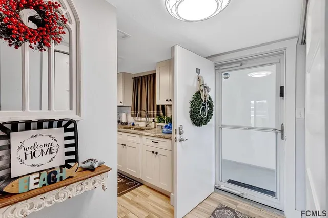 a bathroom with a sink a mirror and shower