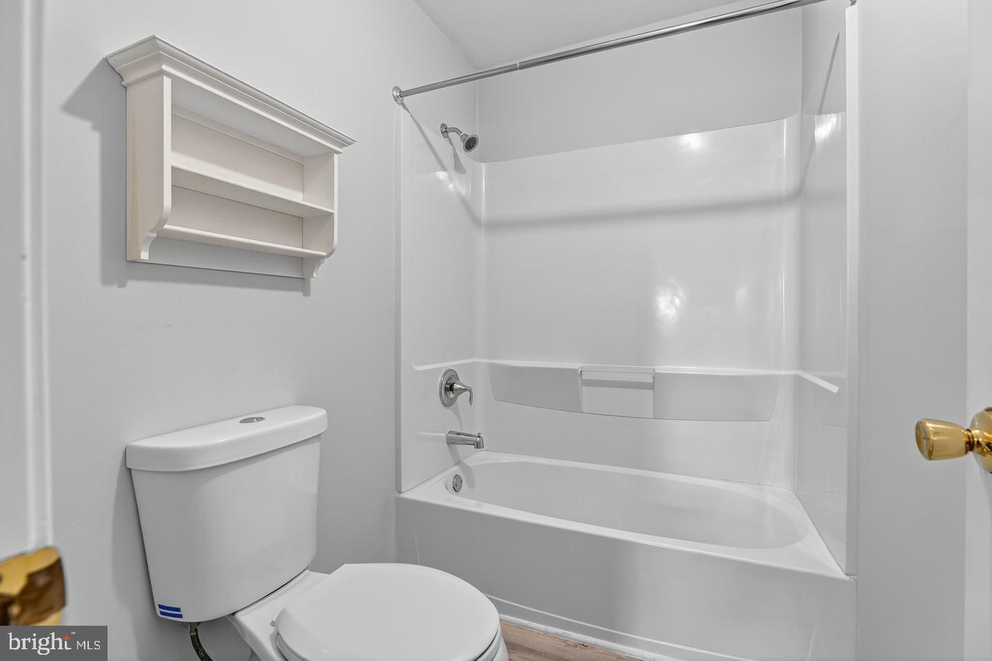 23 Janwall Court Annapolis, MD 21403 - Photo 13 of 28 a white toilet sitting next to a bath tub