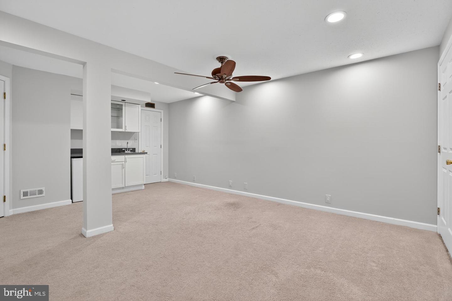 23 Janwall Court Annapolis, MD 21403 - Photo 18 of 28 an empty room with chandelier fan and windows