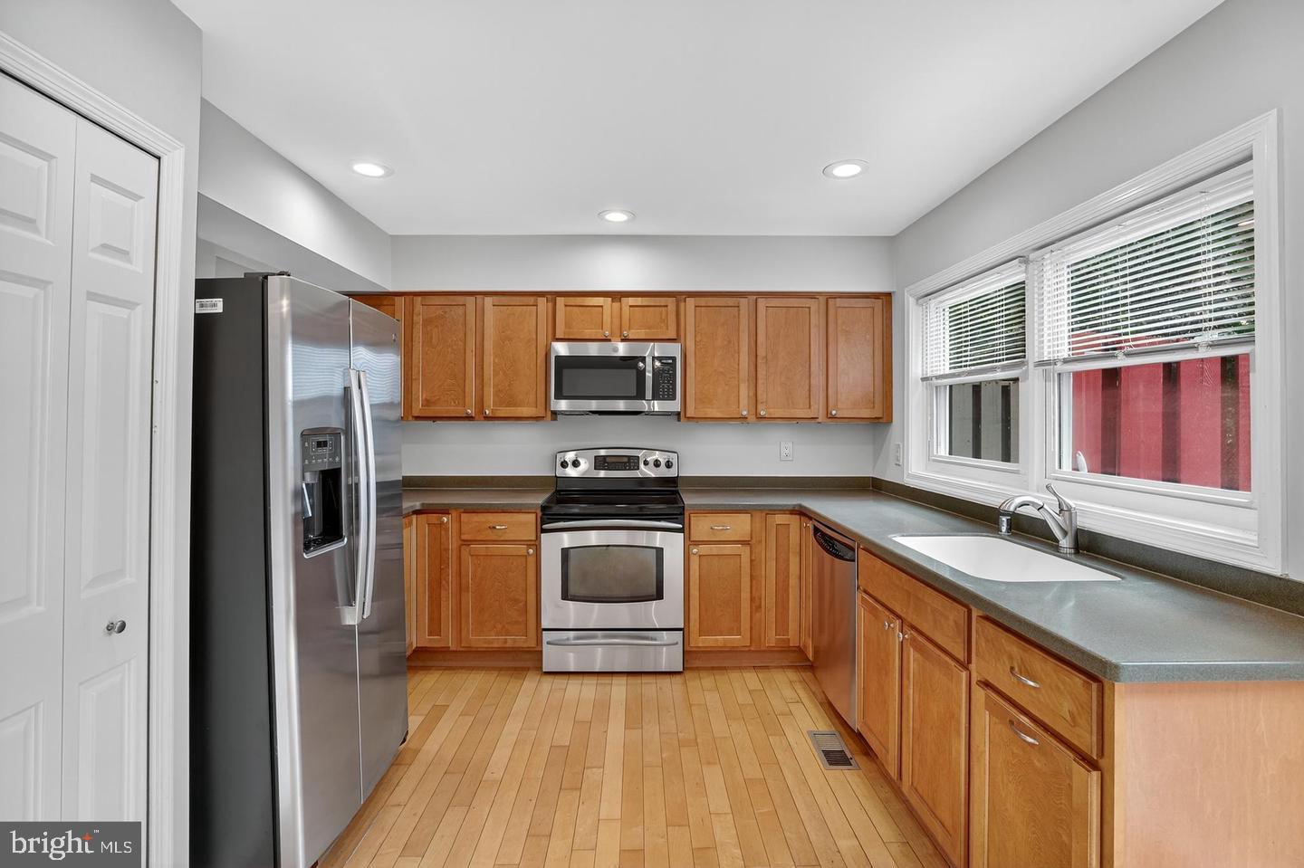 23 Janwall Court Annapolis, MD 21403 - Photo 2 of 28 a kitchen with stainless steel appliances granite countertop a stove a sink dishwasher a refrigerator and a microwave oven with wooden floor