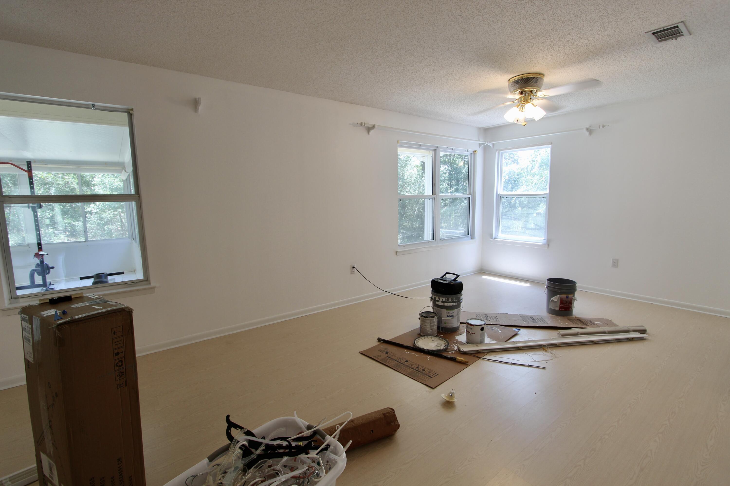 1088 Tallokas Road Crestview, FL 32536 - Photo 11 of 16 a room with gym equipment on the wall and windows