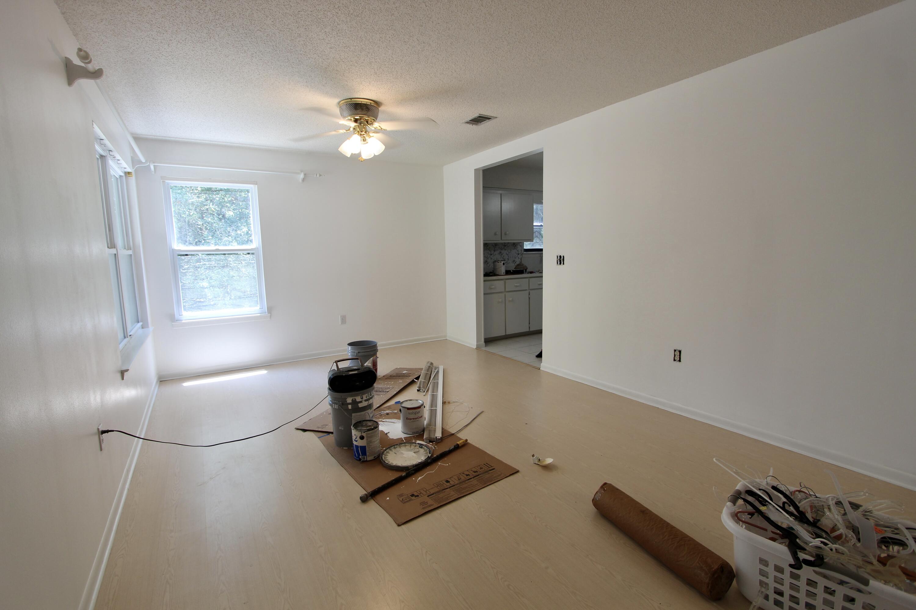 1088 Tallokas Road Crestview, FL 32536 - Photo 12 of 16 a living room with furniture and a chandelier