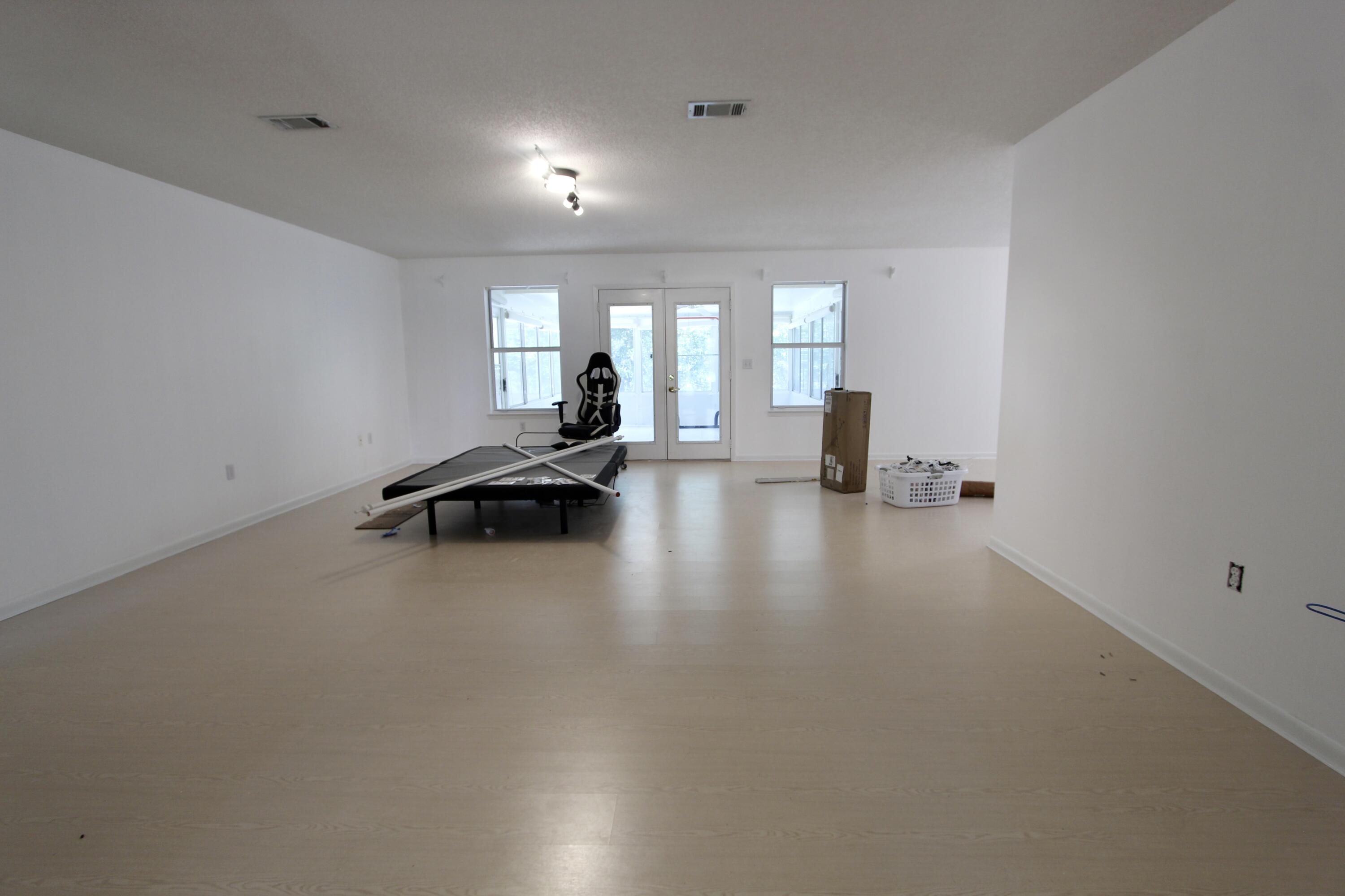 1088 Tallokas Road Crestview, FL 32536 - Photo 13 of 16 a view of empty room with lounge chair