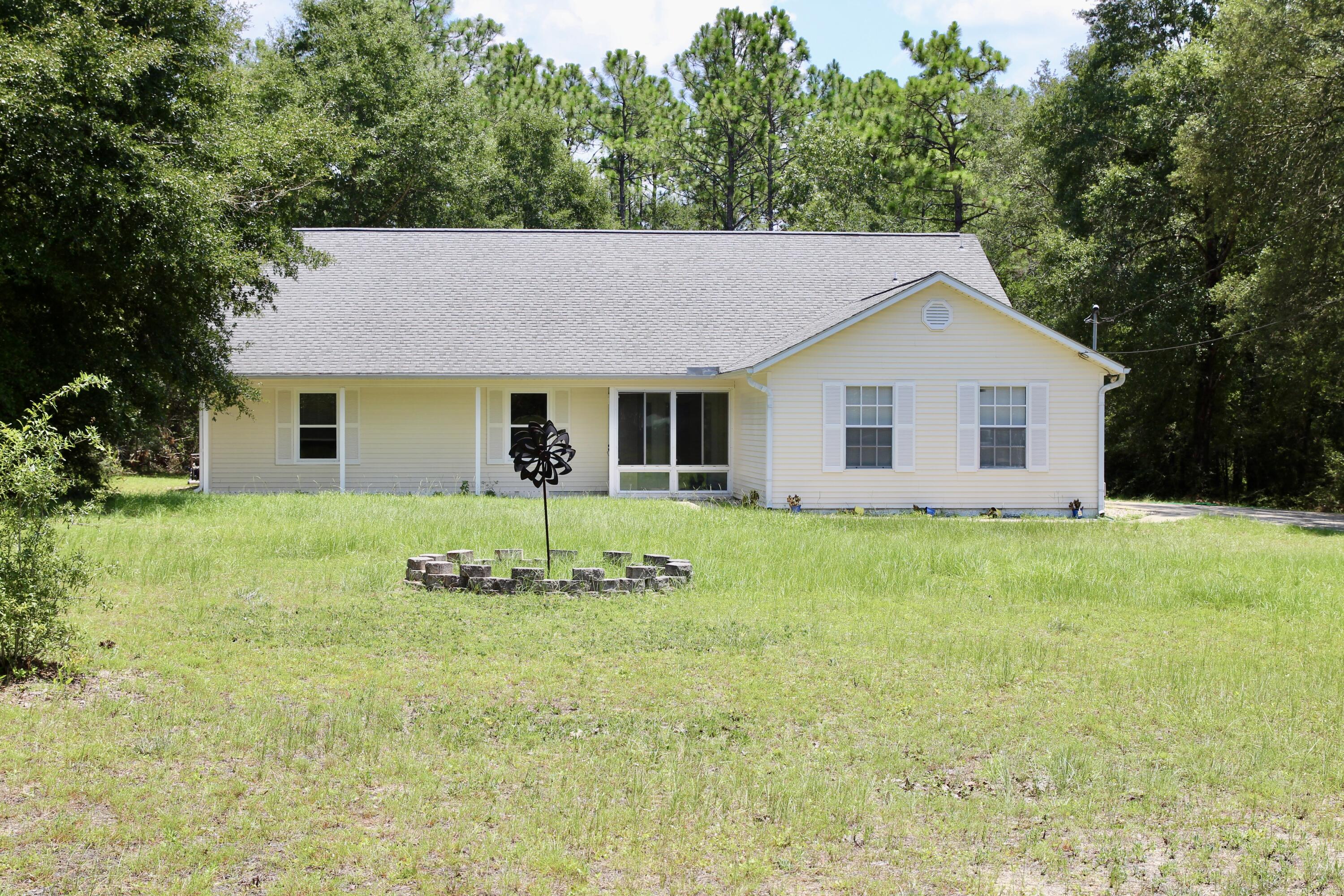 1088 Tallokas Road Crestview, FL 32536 - Photo 2 of 16 a view of a house with backyard