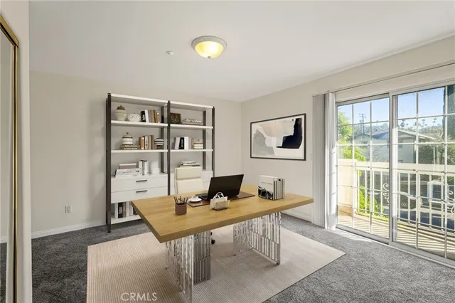 a workspace with furniture and a window