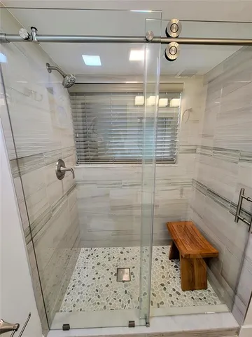 a bathroom with a shower and a toilet
