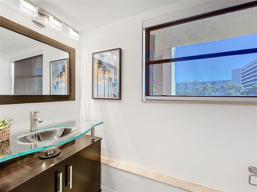 364 Golfview Road, Unit 507 North Palm Beach, FL 33408 - Photo 22 of 25 a bathroom with a sink and a mirror