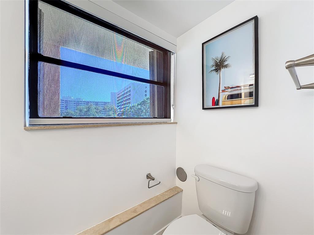 364 Golfview Road, Unit 507 North Palm Beach, FL 33408 - Photo 23 of 25 a white wall painting on the wall and a window