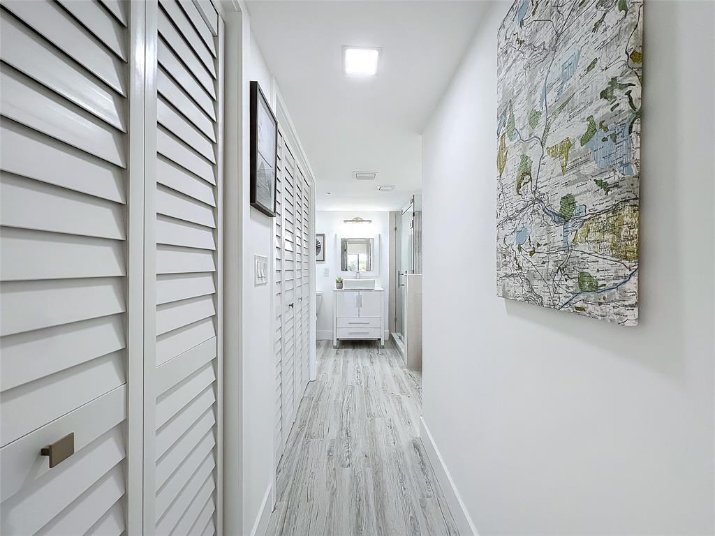 364 Golfview Road, Unit 507 North Palm Beach, FL 33408 - Photo 24 of 25 a view of a hallway with wooden floor and staircase