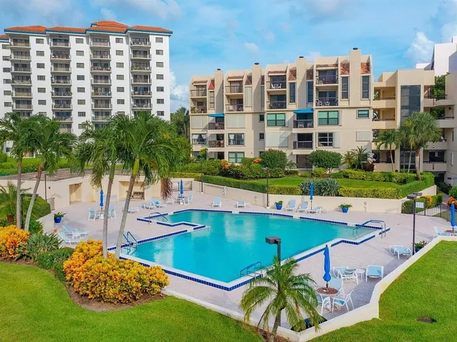 a view of a swimming pool with a lounge chairs