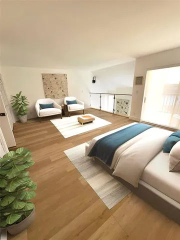 a bedroom with a bed and a couch