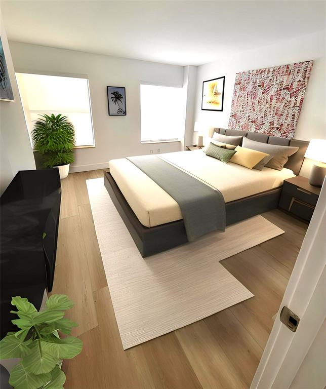 364 Golfview Road, Unit 507 North Palm Beach, FL 33408 - Photo 10 of 25 a bedroom with a bed lamp and a potted plant